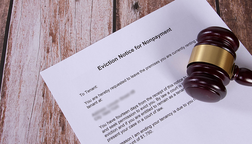 Eviction Notice for Nonpayment document with a wooden judge gavel