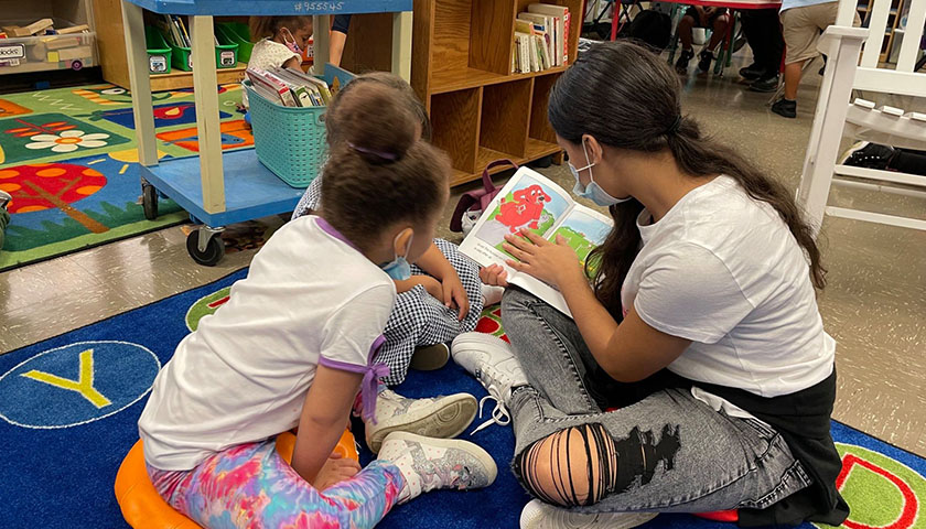 Cleveland Metropolitan School District 8th grade students read with their kindergarten buddies and help the young learners discover the joy of reading.