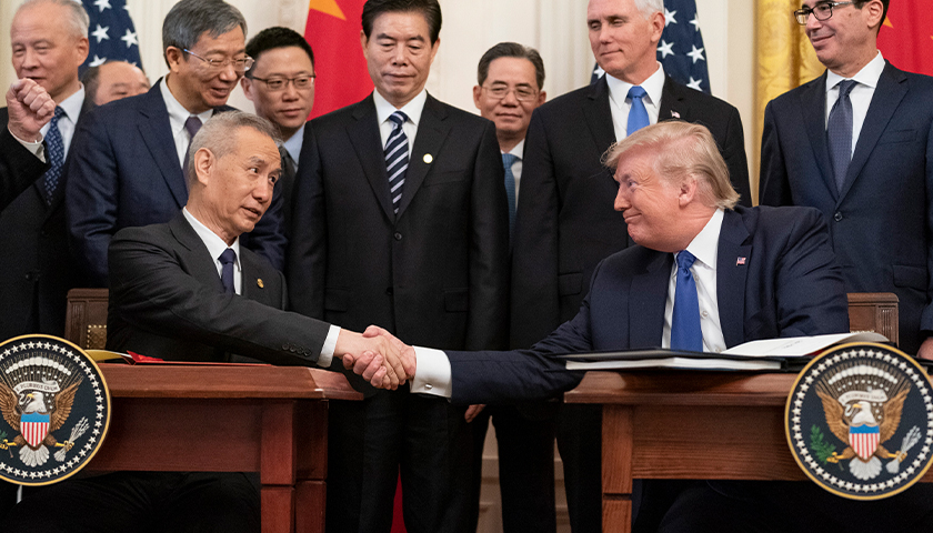 President Donald J. Trump, joined by Chinese Vice Premier Liu He, sign the U.S. China Phase One Trade Agreement Wednesday, Jan. 15, 2020, in the East Room of the White House. (Official White House Photo by Shealah Craighead)