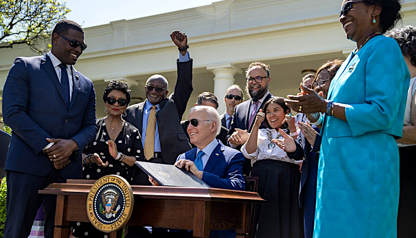 President Biden signing a bill