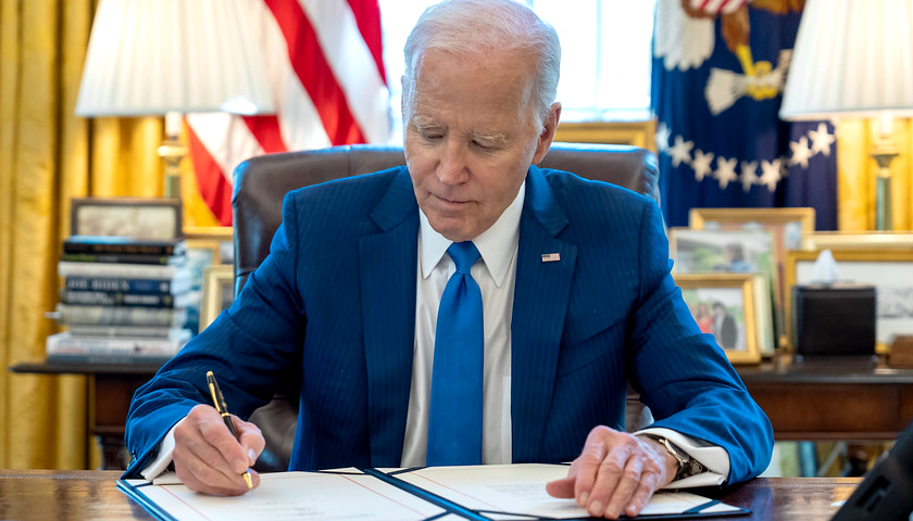 President Joe Biden signing a bill