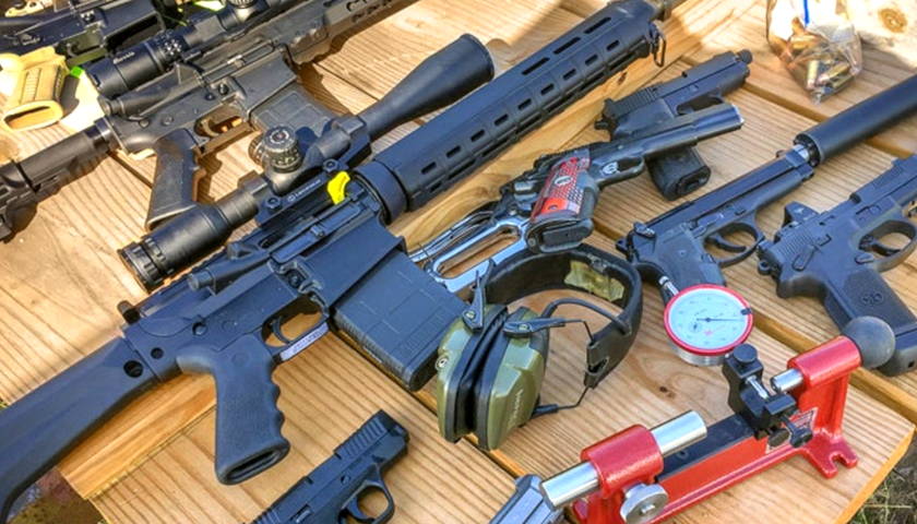 A selection of modern firearms on a table